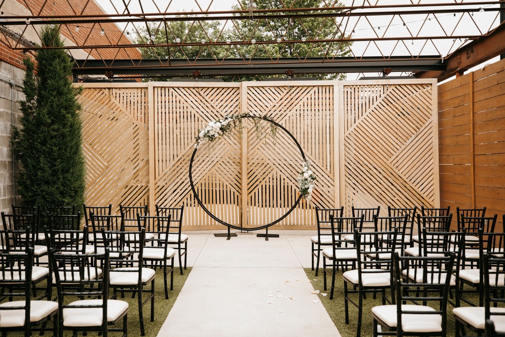 Black Ring, Outdoor Ceremony, Sage Cream Floral Swags.jpg